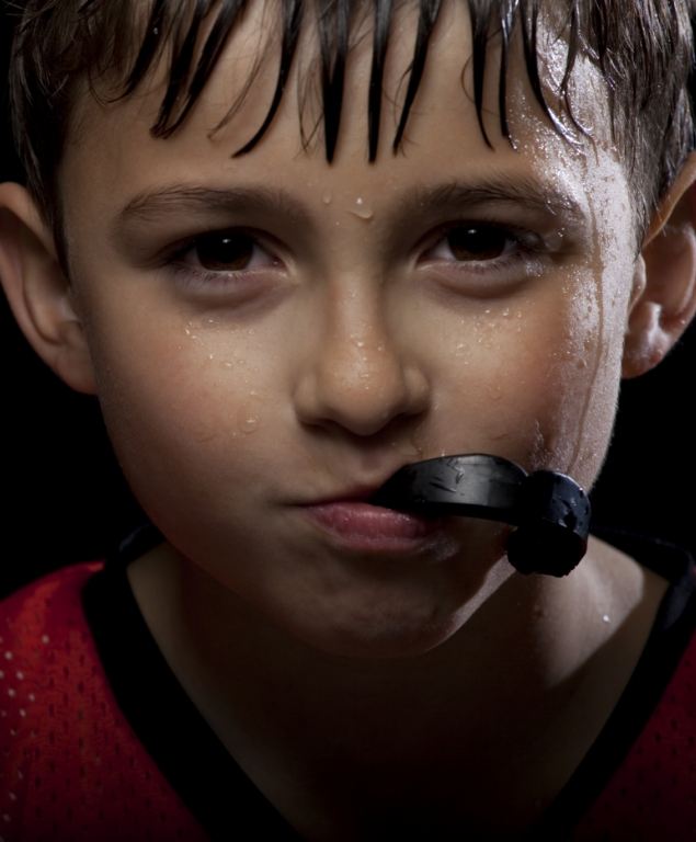 Young boy wearing a black athletic mouthguard in Cambridge